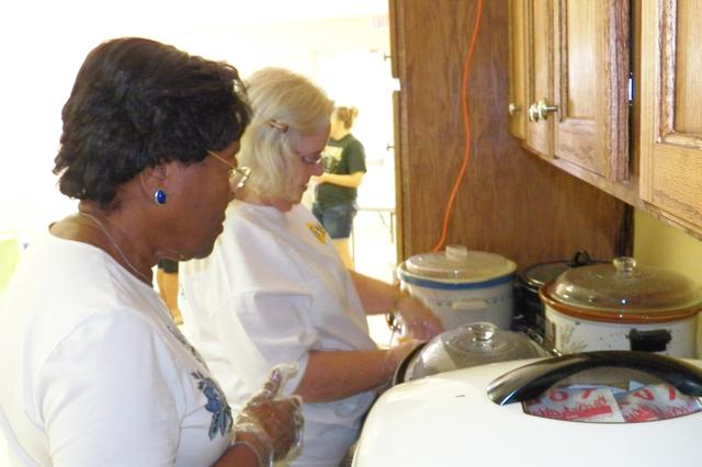 Making sure the hotdogs are warm