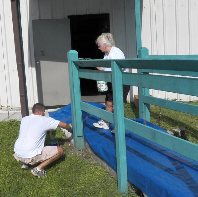 Painting the bridge railing