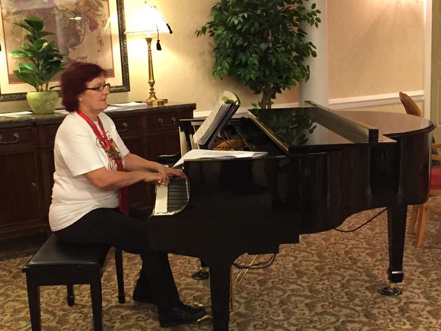 Kathy accompanies the carolers